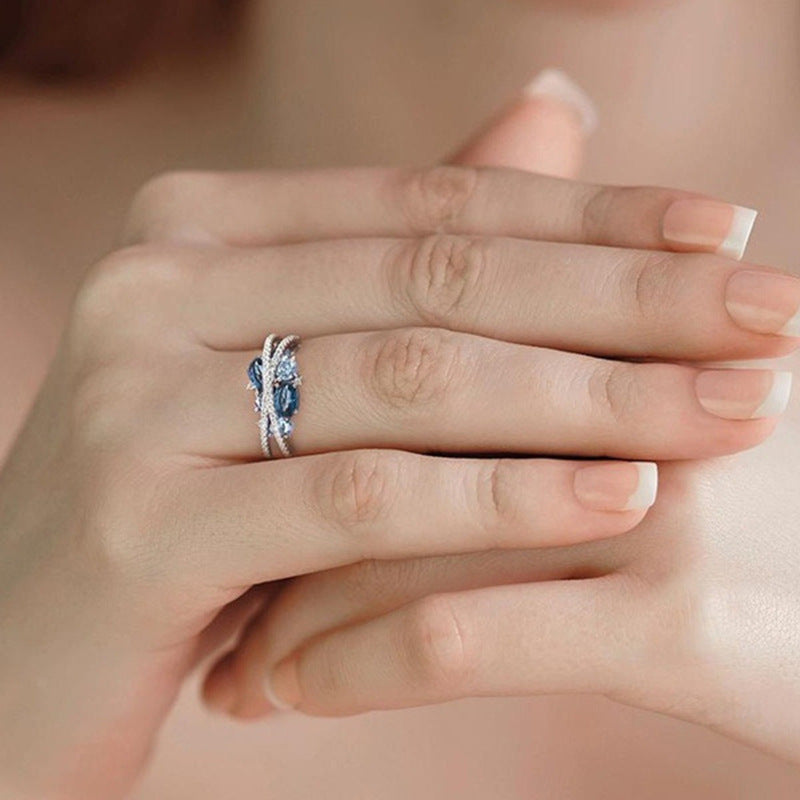 Fashion X-shaped Hollow Jeweled Blue Zircon Rings