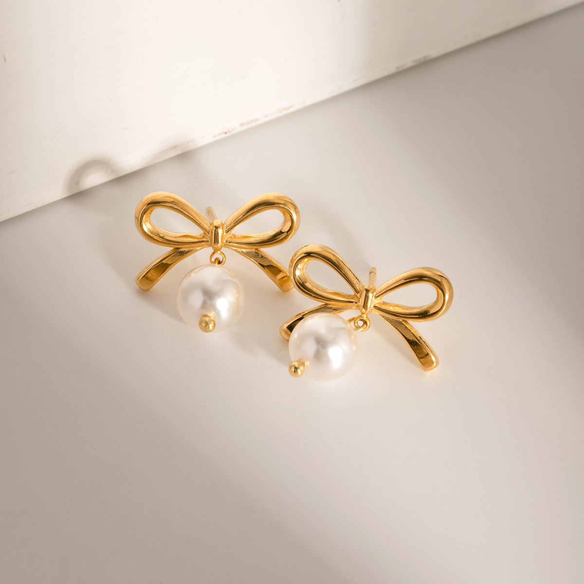 Unique Gold-plated Stainless Steel Bow Pearl Earrings